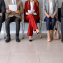 potential new hires wait to be interviewed by hr agent